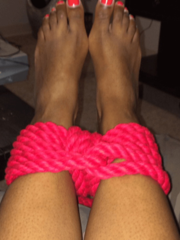 Red rope tied around Cara’s ankles